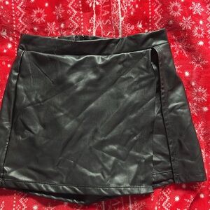 Black leather mini skort from Altar’d State